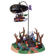Polyresin village accent for a Lemax display. Designed to look like a blimp flying over a small house near a graveyard.