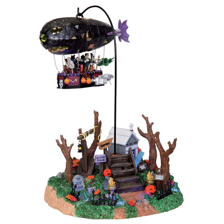 Polyresin village accent for a Lemax display. Designed to look like a blimp flying over a small house near a graveyard.