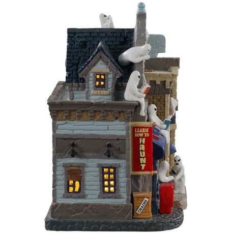 Porcelain lighted building for a Lemax Spooky Town display. Designed to look like a school with different ghosts throughout. Some of the ghosts are reading on the roof. There's a newspaper box on the sidewalk.