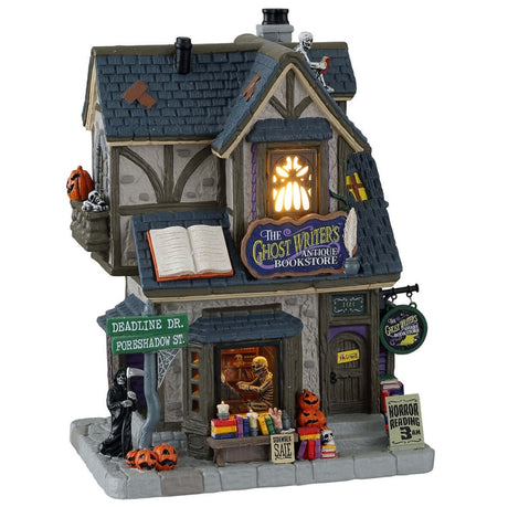 Porcelain lighted building for a Lemax display. Designed to look like a house that's been turned into a bookstore. There are skeletons reading, a Grim Reaper on the sidewalk and a shelf of books for sale outside. 