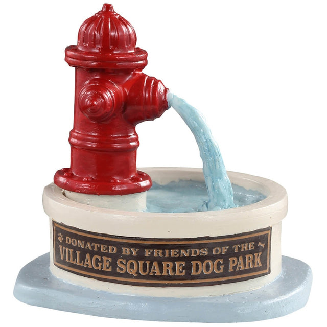 Polyresin figure for a Lemax display. Designed to look like a red fire hydrant spilling water into a big bowl. The bowl has a plaque on it that reads "Donated by Friends of the Village Square Dog Park."