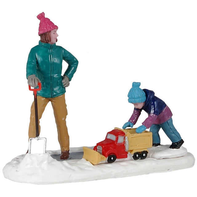 Polyresin figurine for a Lemax Village display. Designed to look like a mom shoveling snow while a child plays with a toy snow plow