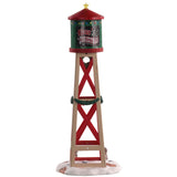 Polyresin figurine for a Lemax Village tabletop display. Designed to look like a red, green and brown water tower. The water tower features Santa's face, a yellow star on the top, a wreath and garland. There are two bunnies in the snow at the bottom