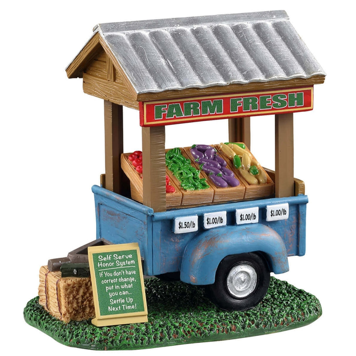 Polyresin figure for a Lemax display. Designed to look like a blue vegetable cart. There's a sign that reads "FARM FRESH" on the cart. Next to the cart, there's a sign on the ground that reads "Self serve honor system: If you don't have correct change, put in what you can... Settle up next time!" Inside the cart, there are tomatoes, green beans, eggplants and corn on the cob.