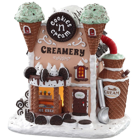 Porcelain lighted building for a Lemax Village tabletop display. Designed to look like a building made out of waffle cones, ice cream, Oreos and candy