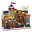 Polyresin lighted building for Lemax display. Designed to look like a wooden post office. There's a red flag on top of the roof that reads "Santa Post." There's a big sign that's shaped like an envelope that reads "Letters to Santa." There's a big clock and it reads "Always on time" underneath. Next to the clock it reads "North Pole Mail Room." There's an elf pushing a big cart of mail.