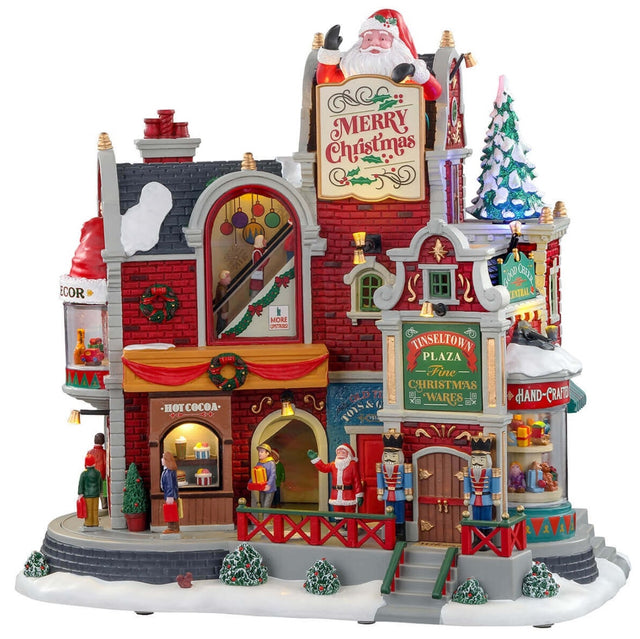 Polyresin lighted building for a Lemax Village tabletop display. A big mall decorated for Christmas with lots of people shopping