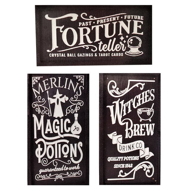 Carved Halloween signs. One reads "Past, Present, Future Fortune Teller. Crystal ball gazings and tarot cards." One reads "Merlins Magic Potions guaranteed to work." One reads "Wiches Brew Drink Co. quality potions since 1542."