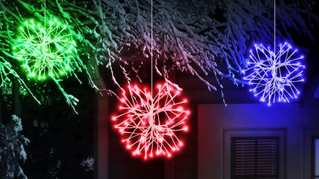 LED snowburst decorations. One is green, one is red and one is blue.