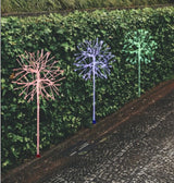 LED snowburst decorations. One is red, one is blue and one is green.
