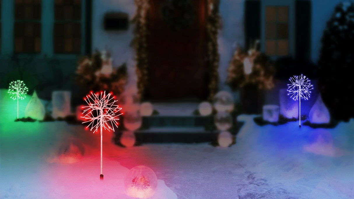 LED snowburst decorations. One is green, one is red and one is blue.