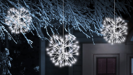 Three pure white LED snowburst decorations.
