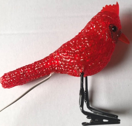 A red clip-on LED ornament.