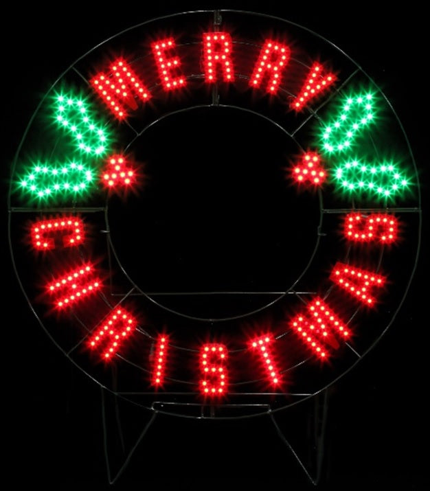 Outdoor LED decoration that reads "Merry Christmas." The text is red. There are green holly leaves and red berries.