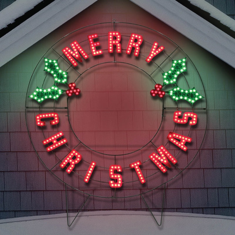 Outdoor LED decoration that reads "Merry Christmas." The text is red. There are green holly leaves and red berries.