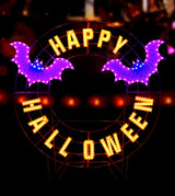 LED Halloween decoration pre-lit with warm white and purple lights. Wire is shaped like a wreath and reads "HAPPY HALLOWEEN" and features two purple bats.