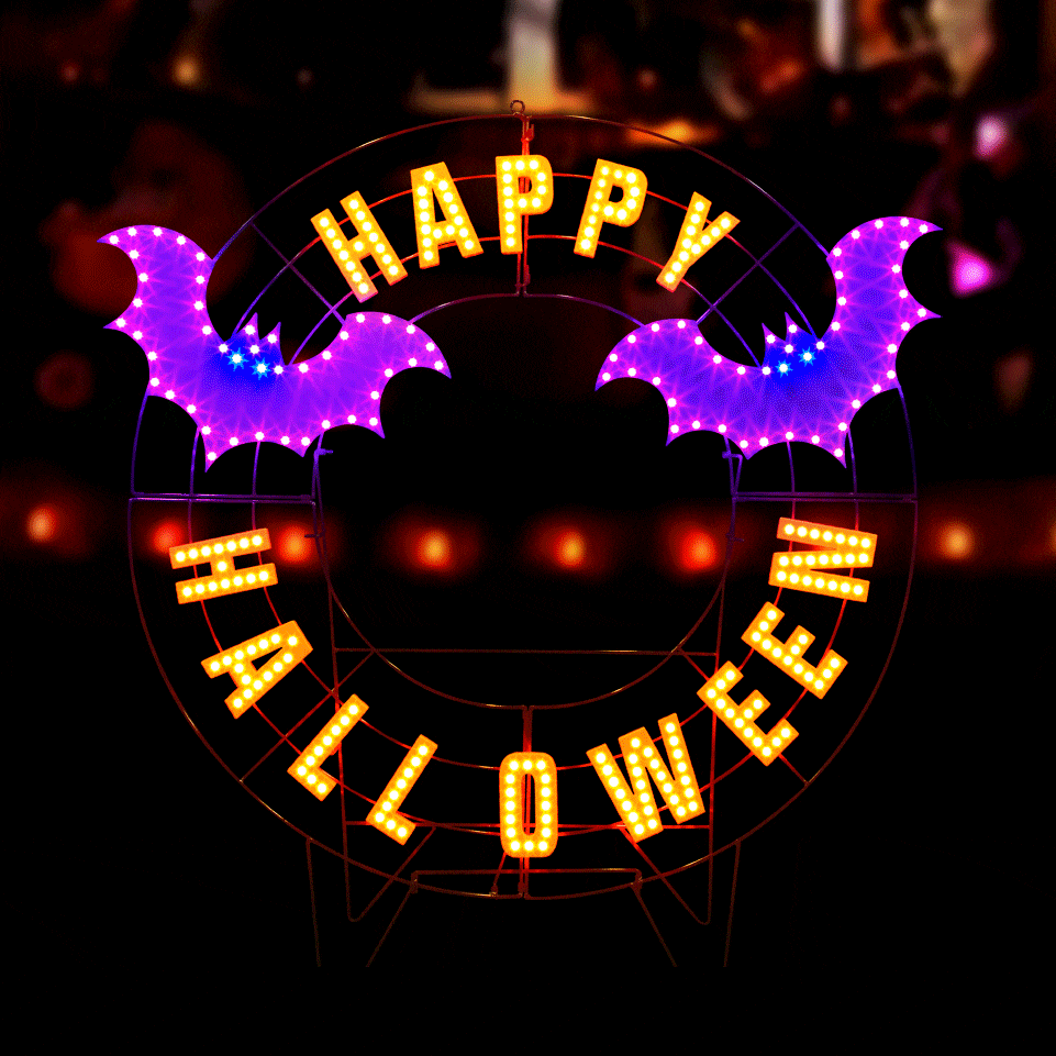LED Halloween decoration pre-lit with warm white and purple lights. Wire is shaped like a wreath and reads "HAPPY HALLOWEEN" and features two purple bats.