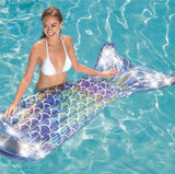 Silver, holographic pool float shaped like a mermaid's tail.