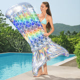 Silver, holographic pool float shaped like a mermaid's tail.