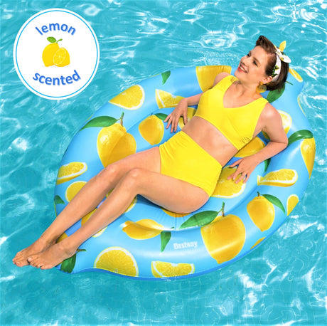 Light blue inflatable pool float with yellow lemons and green leaves on it. The float itself is lemon shaped AND lemon scented.