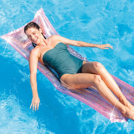 Pink and glittery inflatable pool mattress.