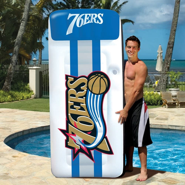 Pool mattress with Philadelphia 76ers logos on it.