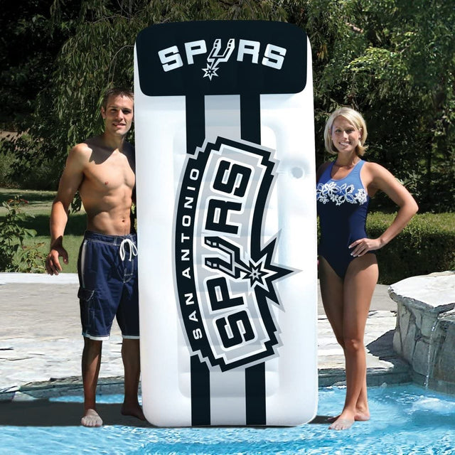Pool mattress with San Antonio Spurs logos on it.