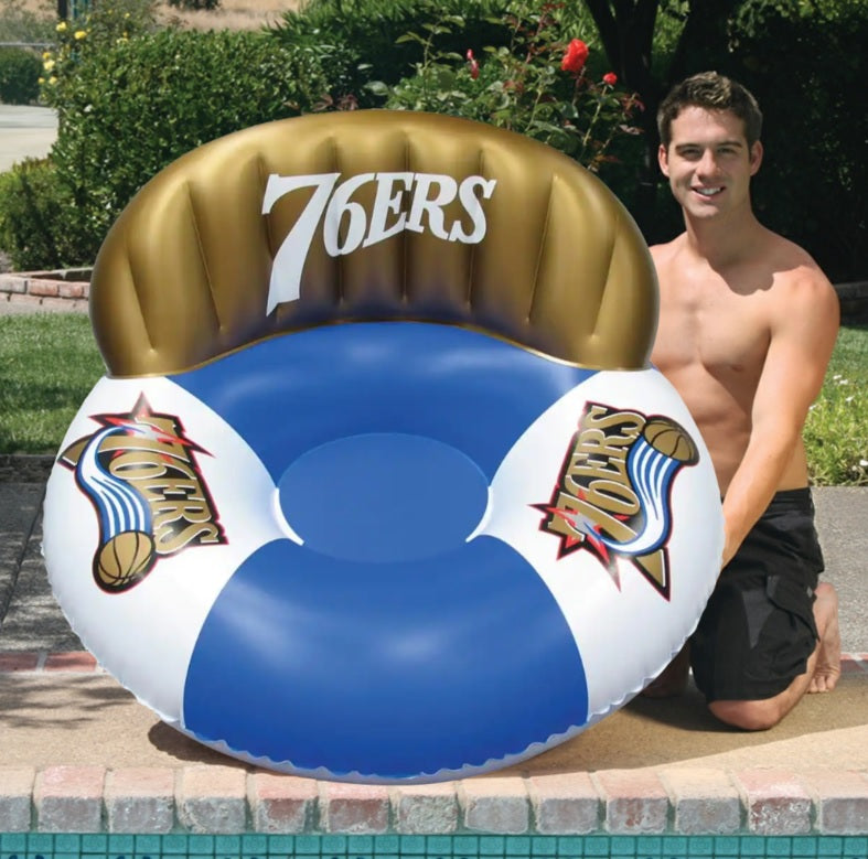Pool lounge with the Philadelphia 76ers logos on it.