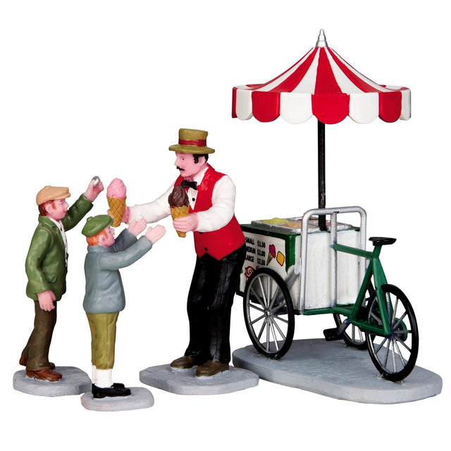 Polyresin figurines for a Lemax display. Designed to look like an ice cream vendor handing ice cream to two young children.