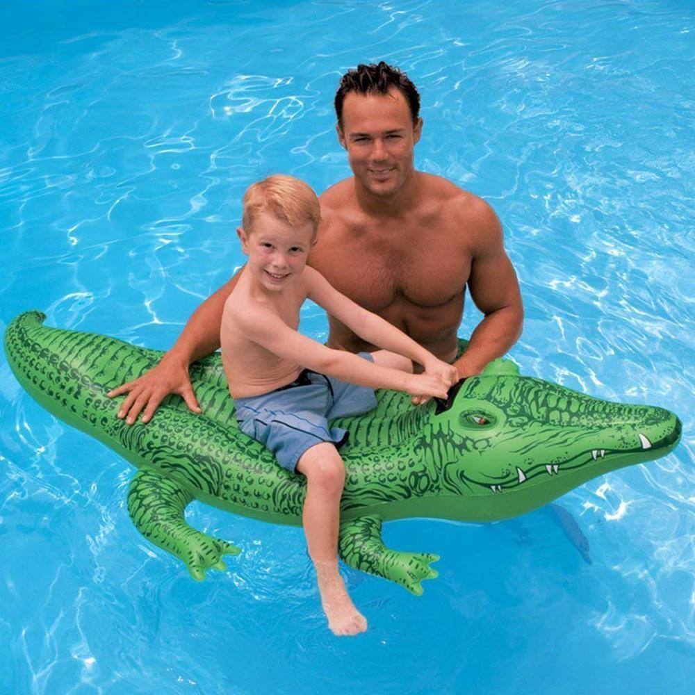 Pool inflatable shaped like an alligator.
