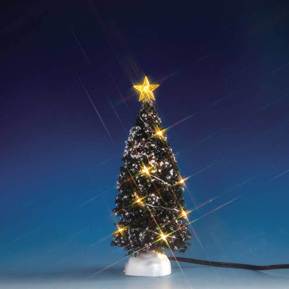 Lemax village accessory designed to look like a snow-covered tree that has yellow lights on it and a yellow star on top.