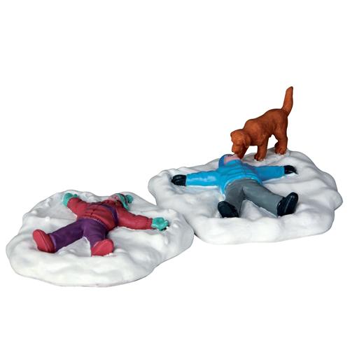 Village accent for a Lemax display. Designed to look like two young kids making snow angels on the ground. They're wearing winter clothes and there's a dog watching.