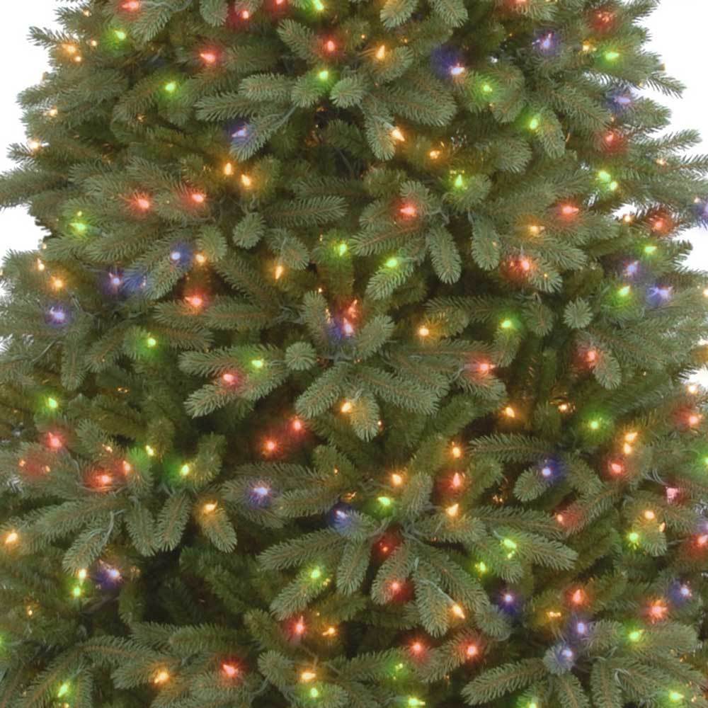 Artificial tree pre-lit with multi-colored lights.