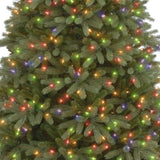 Artificial tree pre-lit with multi-colored lights.