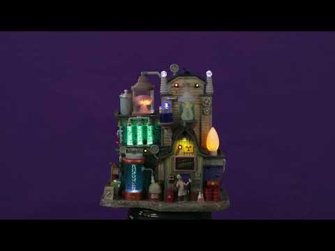Resin lighted building for a Lemax display. Designed to look like a barn turned into a laboratory. There large and small vials of liquid. There's a brain on the roof and a skeleton standing in front of barrels of chemicals.