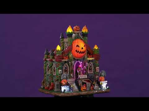 Resin building for a Lemax display. Designed to look like a crypt decorated with carved pumpkins, skulls, flames, vines, tombstones and broken windows.