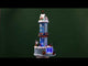 Resin village accent for a Lemax display. Designed to look like a winter-themed carnival ride. Santa and a reindeer stand on the top. There are people on the ride and people standing in line. The backdrop of the ride is designed to look like a thermometer.