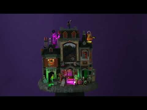 Polyresin building for a Lemax display. Designed to look like a large, brick hotel. There's a Grim Reaper on the roof along with an hourglass statue and a lock and key statue. Inside the large window, you can see people walking up stairs.