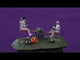 Resin village accent for a Spooky Town Lemax display. Designed to look like two skeletons on a teeter totter. One skeleton is wearing a top hat and has his leg on a carved pumpkin. There are two gravestones in the middle of the teeter totter that read RIP.