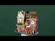 Resin lighted building facade for a Lemax display. Designed to look like a bunch of different store fronts in a public farmer's market. There's a cheese shop, a historic district and a cheese market.
