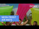 Neon colored pool mattresses.