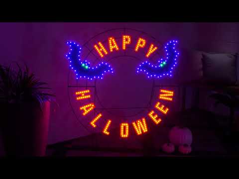 LED Halloween decoration pre-lit with warm white and purple lights. Wire is shaped like a wreath and reads "HAPPY HALLOWEEN" and features two purple bats.